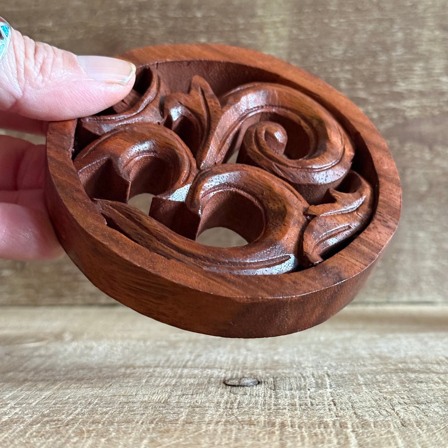 Invite harmony and sacred energy into your home with this Hand Carved Wooden Om Wall Hanging, beautifully crafted from sustainably sourced suar wood. Each piece is individually hand carved by skilled artisans, honouring the traditional techniques that celebrate both craftsmanship and spirituality.