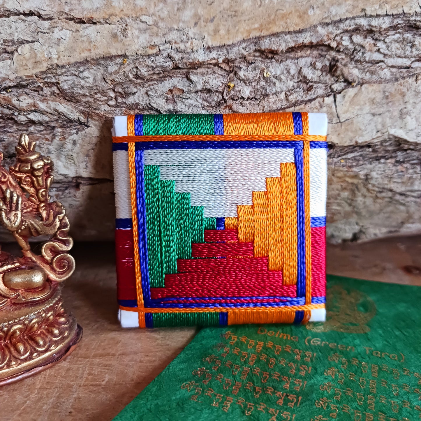 Experience divine protection with the handmade Green Tara Protection Amulet, a masterpiece of spirituality crafted in Nepal.