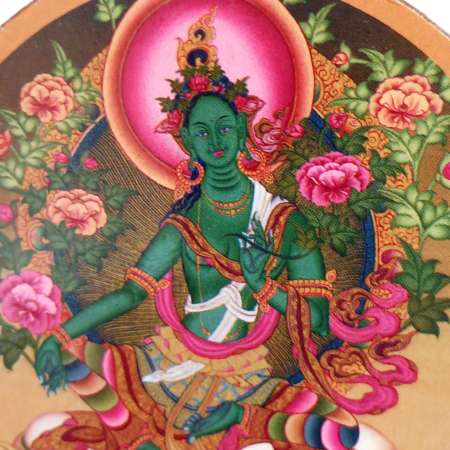 Green Tara is a female Buddha. Her name means Star or bridge, transition. Metaphor for: she who helps to cross the ocean of suffering. Green Tara is depicted as a young girl or woman, relaxed, playful and dynamic.