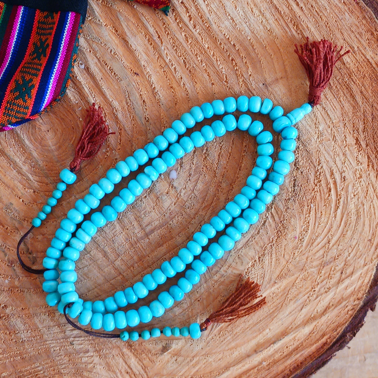 These prayer beads are used to count repeated mantras, serving the same purpose as a rosary. Beads made of semi-precious stones, pearls, bodhi seeds or wood may serve all kinds of goals, like counting any kind of mantras, or other forms of prayer, bows, walk-rounds and such. The cord is the same for every mala, and should be made of nine threads, symbolising the Buddha Vajradhara and the eight Bodhisattvas.