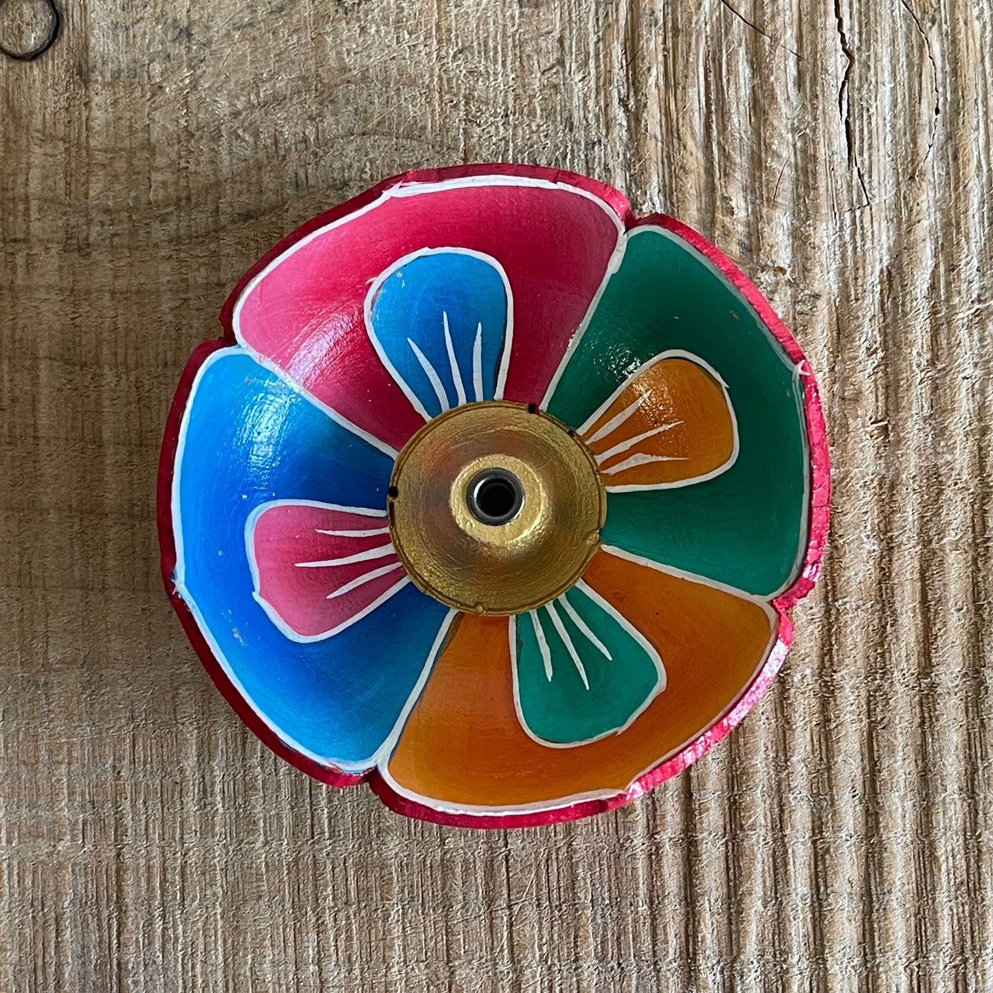 A beautiful Hand painted Tibetan Incense stick holder , Hand painted and ethically sourced this incense Holder is Perfect for the Larger Tibetan Incense it also has 4 small holes for Indian sticks.