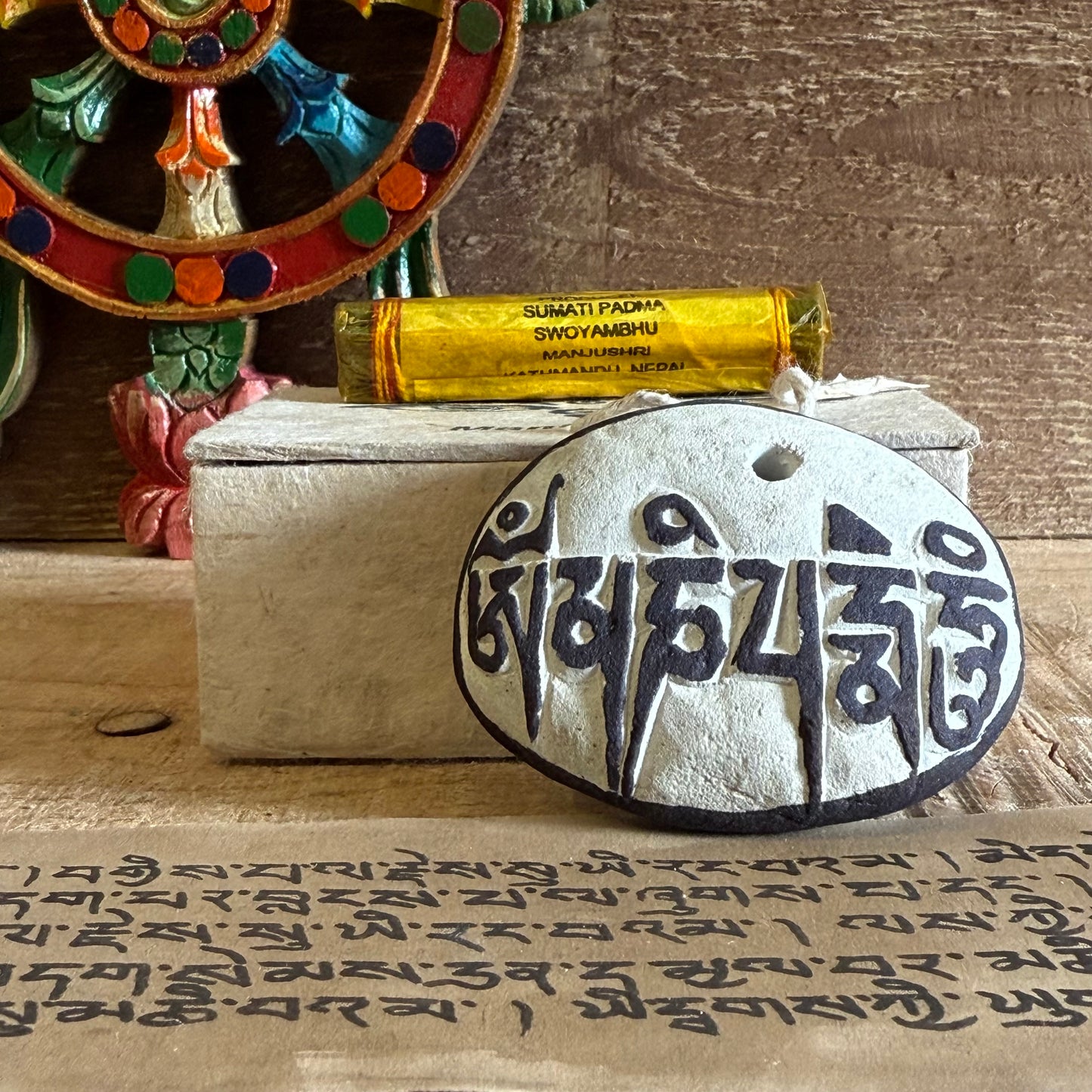 In the sacred lands of the Himalayas, Mani stones are often laid beside paths and rivers, carved with mantras to guide all beings toward enlightenment. This boxed set contains one such stone—a symbol of the Dharma—for your altar, sacred space, or as a meaningful gift.
On one side, the all-seeing eyes of the Buddha gaze with unwavering Wisdom and Compassion. On the reverse, the sacred mantra Om Mani Padme Hum is carved—calling forth the blessings of Chenrezig, the Bodhisattva of Compassion.