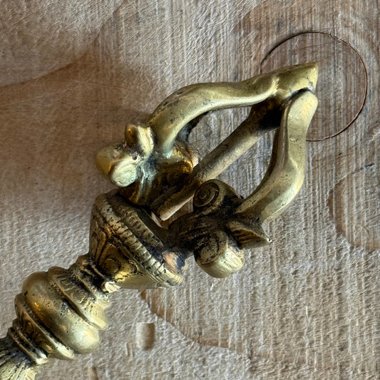 Kirtimukha Dorje vajra ritual object used in Tibetan Buddhism. Symbol of compassion, protection, and skillful action for altar or ceremony.