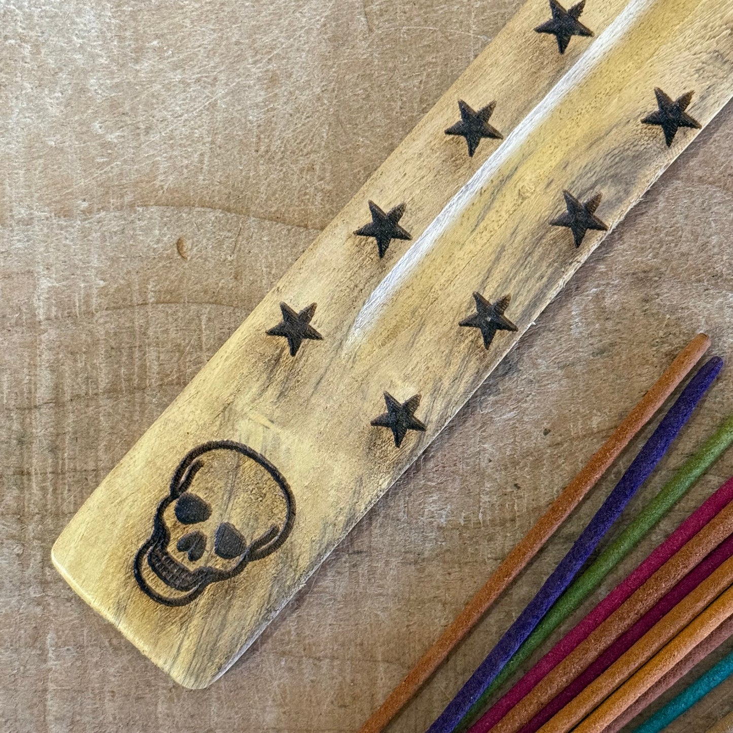 Natural mango wood incense stick holder with hand carved Skull design 26cm