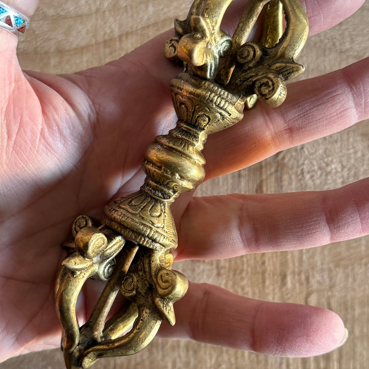 Kirtimukha Dorje vajra ritual object used in Tibetan Buddhism. Symbol of compassion, protection, and skillful action for altar or ceremony.