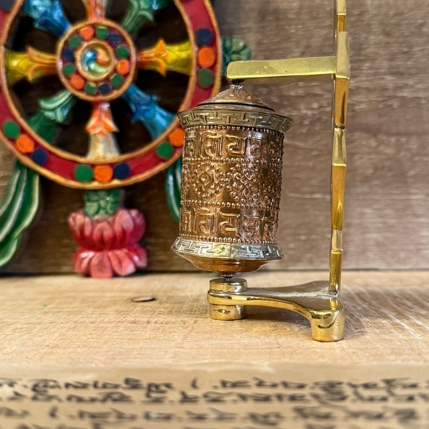 The Endless Knot, painted in a turquoise-green hue, symbolizes the interdependence of all things and the infinite nature of wisdom. Each spin of the copper wheel turns the printed mantras within, radiating blessings and merit in every direction.
A spiritual tool to remind you of the ever-present Dharma, whether in quiet practice or daily life