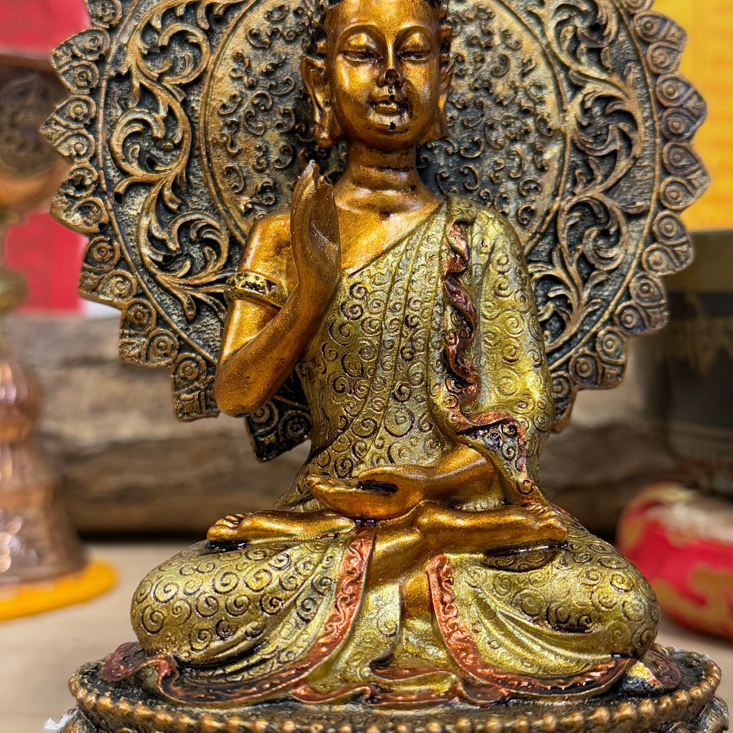 Buddha of Reassurance with Abhaya Mudra – 8cm x 18.5cm
Invite peace and protection into your home with this beautifully detailed Buddha of Reassurance statue, featuring the sacred Abhaya Mudra. Standing at approximately 18.5cm tall and 8cm wide, this exquisite statue captures the Buddha in a gesture of safety, peace, and reassurance. The Abhaya Mudra, where the right hand is raised with the palm facing outward, symbolizes protection, dispelling fear, and offering comfort during times of uncertainty.