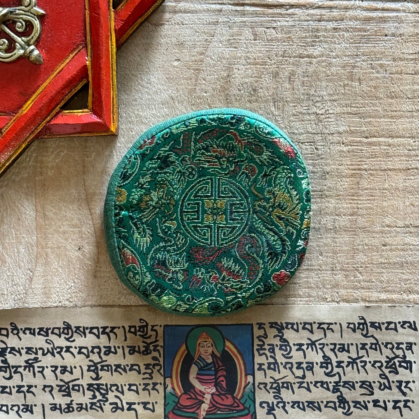 Brocade Singing Bowl Cushion – A Resting Place for Sacred Sound
Rooted in Buddhist tradition, this beautifully embroidered Small Brocade Singing Bowl Cushion offers a place of stillness for your singing bowl, allowing its vibrations to resonate with clarity and harmony.
Features & Benefits:
Support & Stability – Provides a gentle, stable base for your singing bowl, enhancing its resonance.
Elegant Embroidery – Intricate brocade patterns reflect the rich spiritual artistry of Nepal.
Authentical