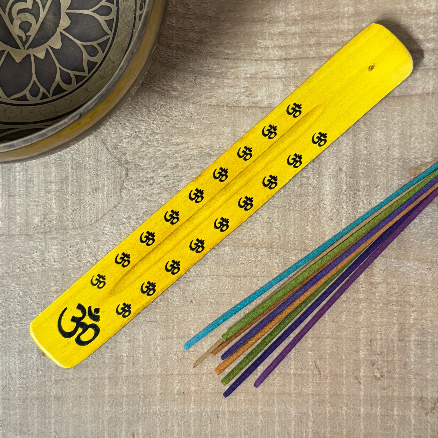 Handcrafted wooden incense holder with Om design for meditation, spiritual rituals, and mindful incense burning.