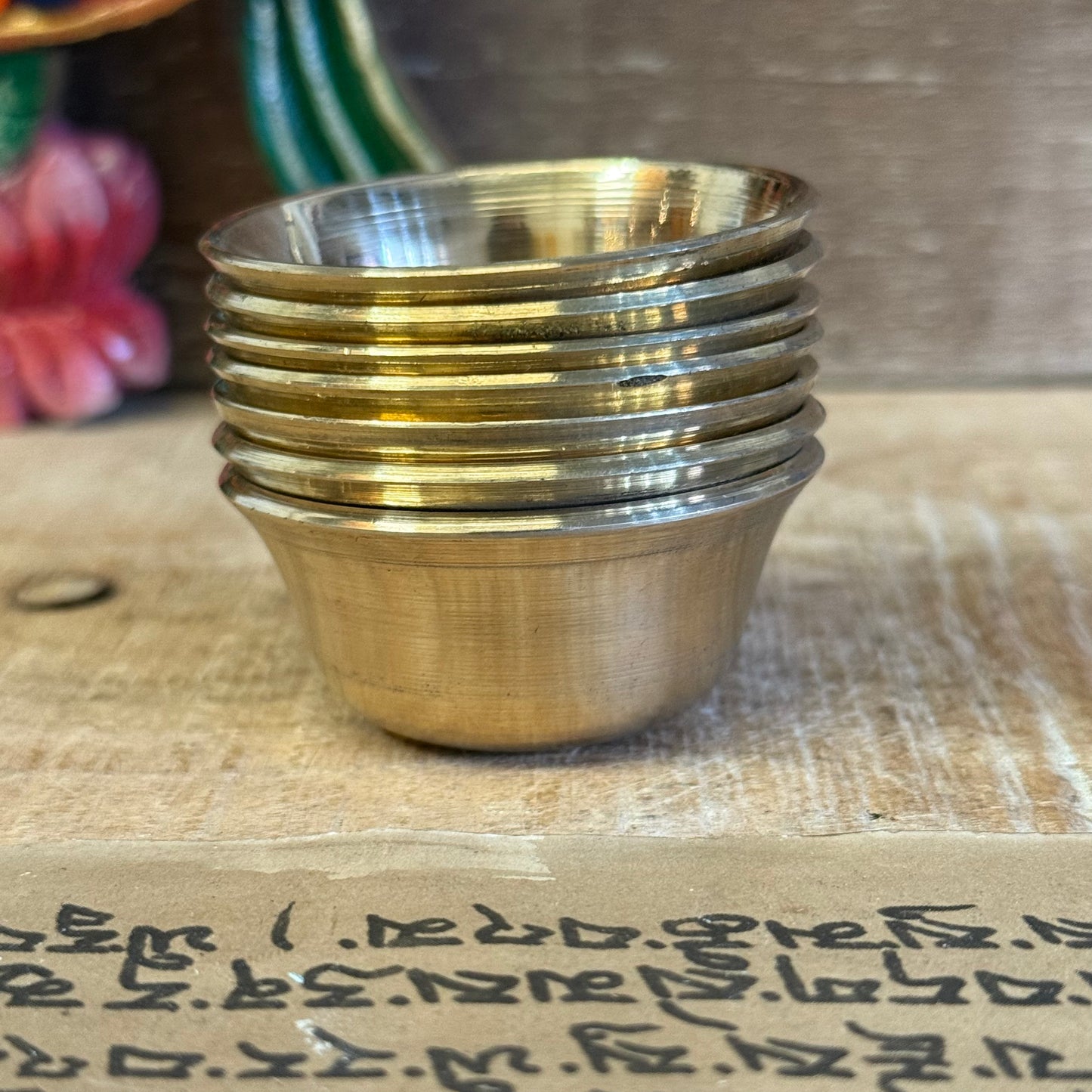 These Small Brass Offering Bowls are used in the sacred practice of making offerings to the Buddhas and Bodhisattvas. A complete set of seven symbolizes the perfection of generosity and is arranged on altars in temples, shrines, or home meditation spaces.
Traditionally, each bowl is filled with substances such as water, incense, perfumed oil, food, flowers, or light—expressing a pure heart and the wish to cultivate virtue. Laying out these offerings is a daily act of devotion, mindfulness, and humility.