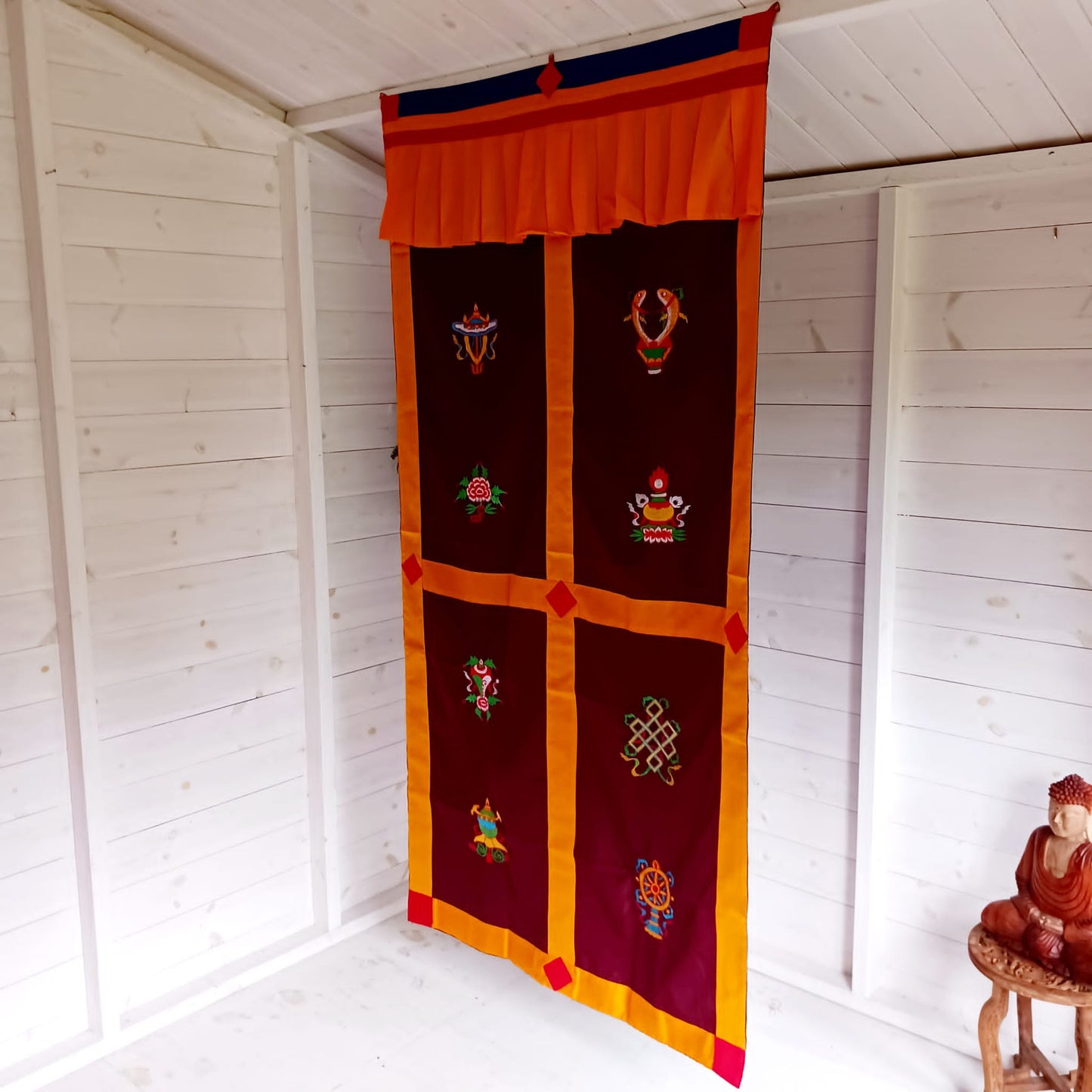 Bring harmony, beauty, and traditional craftsmanship into your space with this hand-embroidered Tibetan Buddhist door curtain, adorned with the sacred Eight Auspicious Symbols, also known as The Eight Jewels. Each symbol is intricately stitched to represent blessings of prosperity, protection, wisdom, and spiritual awakening.