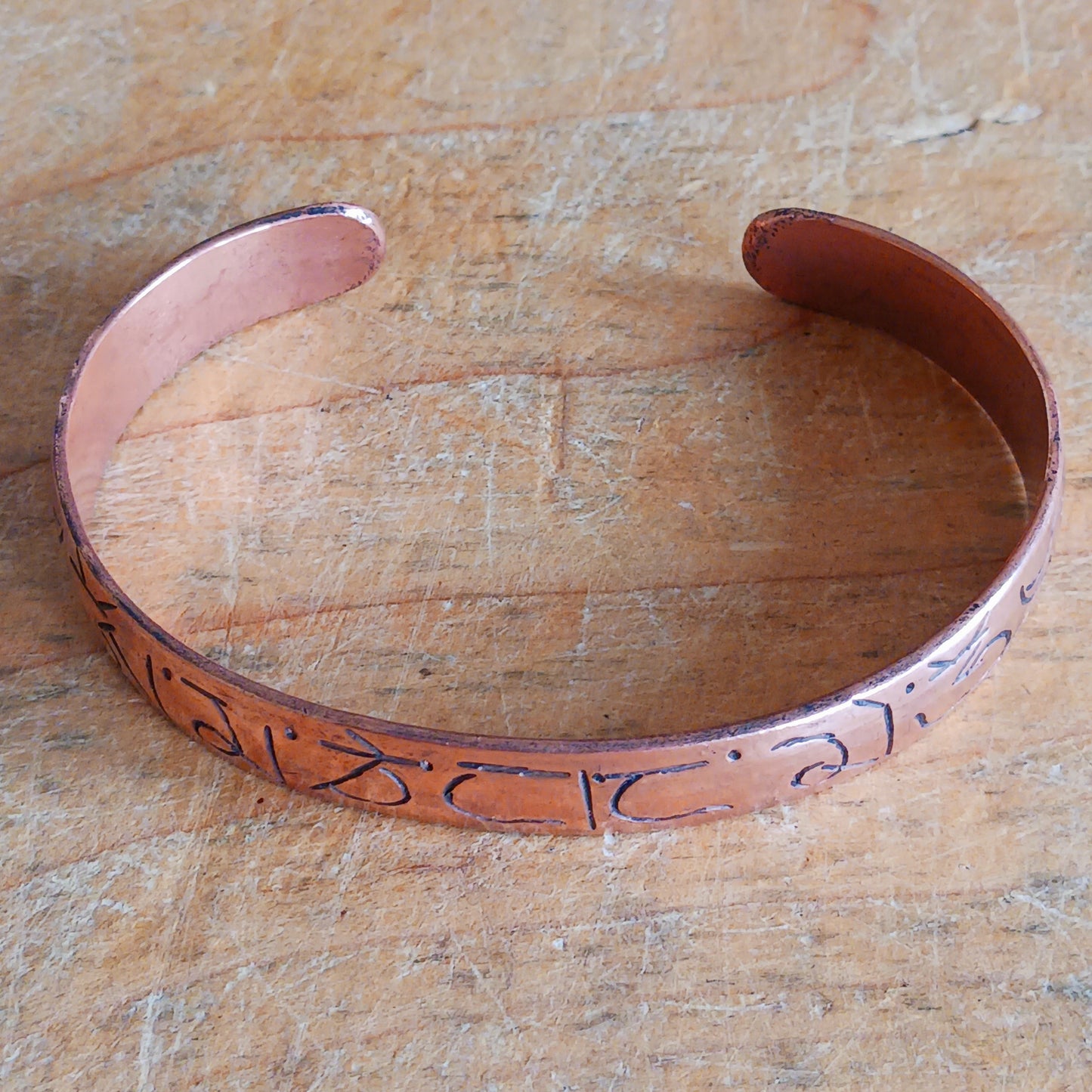 Carry meaning, mindfulness, and craftsmanship with this beautifully hand-etched copper bracelet, featuring the sacred Buddhist mantra Om Mani Padme Hum engraved around the band.