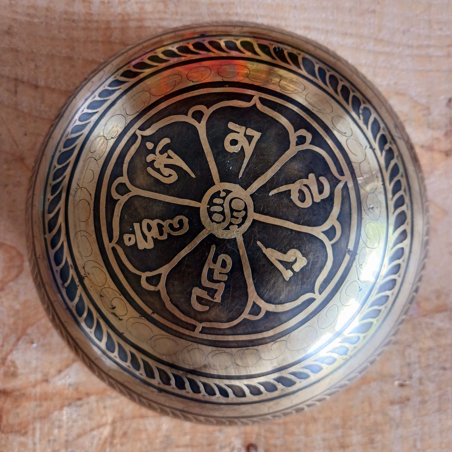 This beautifully crafted Tibetan Singing Bowl is machine made and delicately etched with the sacred Om Mantra, symbolizing universal connection and inner peace. Each bowl is unique in its artistry and design. Traditionally used for meditation and healing, singing bowls help restore harmony between body, mind, and soul.