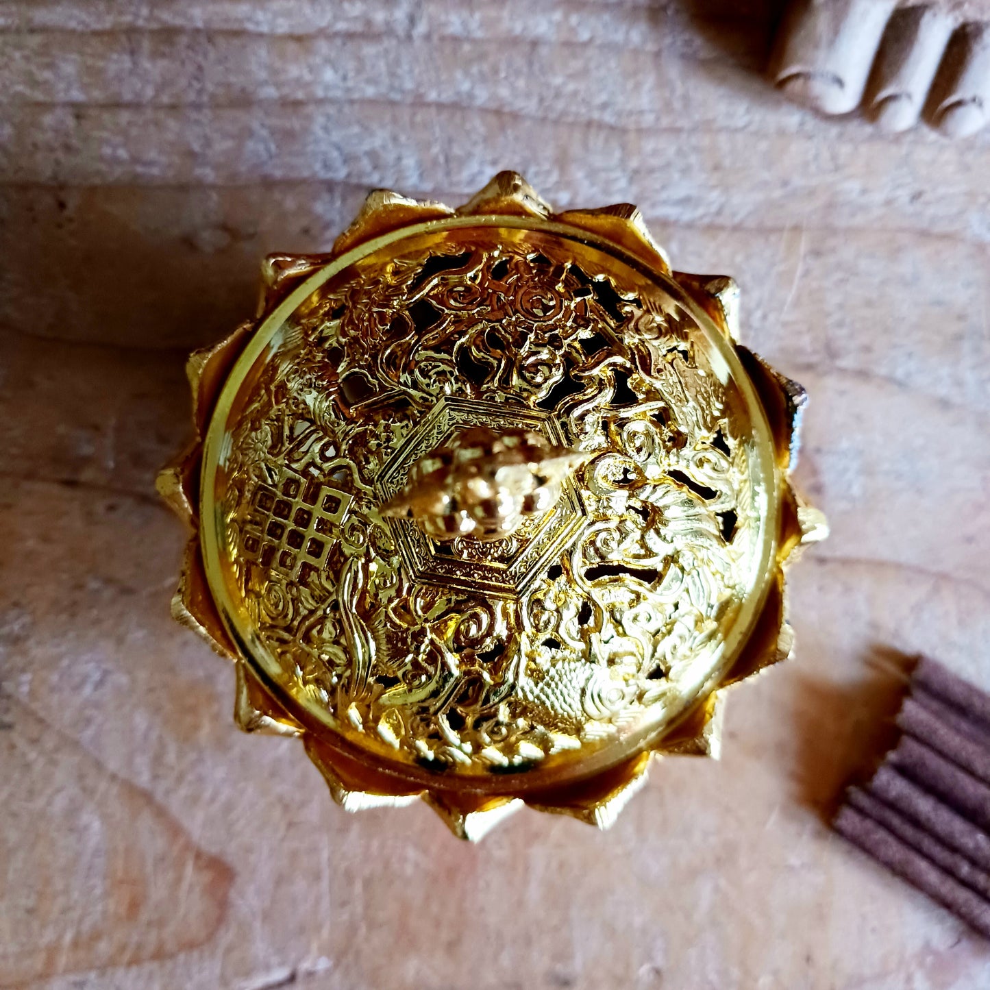 Bring serenity and beauty into your space with this elegant lotus-shaped incense burner, thoughtfully crafted to elevate your rituals and décor. The detailed lotus base symbolizes purity and enlightenment, while the ornate cap is adorned with traditional Tibetan Auspicious symbols, representing harmony, prosperity, and protection.