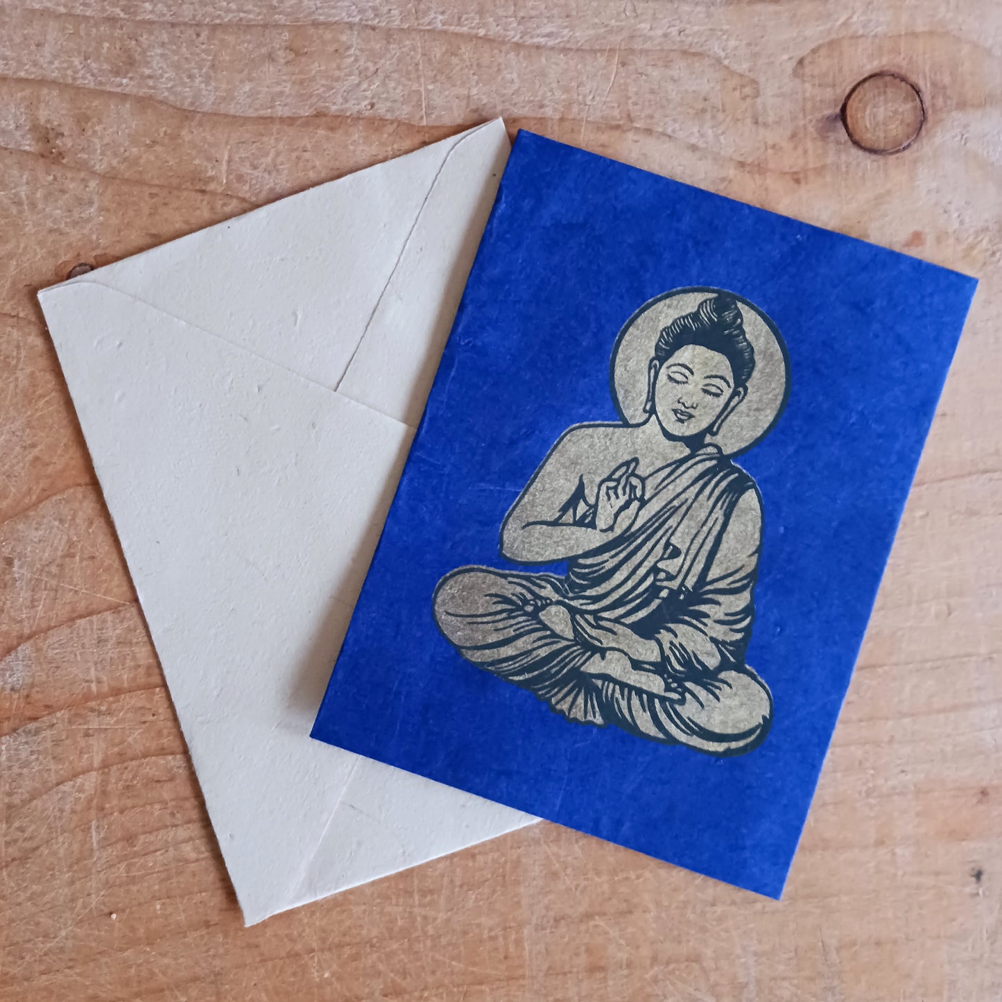 Share peace, colour, and meaningful craftsmanship with this beautifully decorated Buddha greeting card set, handmade from traditional Lokta paper. Sourced from the high-altitude Himalayan forests of Nepal, Lokta paper has been crafted for centuries using sustainable methods. The fast-growing Lokta bush regenerates quickly, making it an eco-friendly alternative to conventional paper.