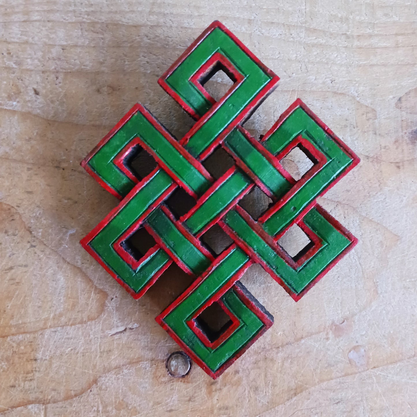 The Eternal (or Endless) Knot is one of the Eight auspicious symbols in Tibetan Buddhism. Because the knot has no beginning and no end, the eternal knot symbolizes the endless wisdom and compassion of the Buddha.