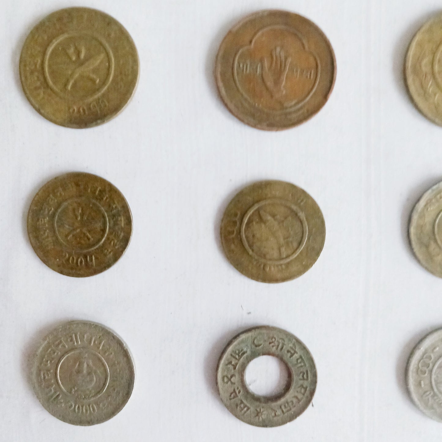 Explore the rich numismatic heritage of Nepal with this curated collection of vintage coins from the reign of King Tribhuvan Bir Bikram Shah Dev (1911–1955 AD). Each coin is a tangible piece of history, reflecting a transformative era that shaped modern Nepal.