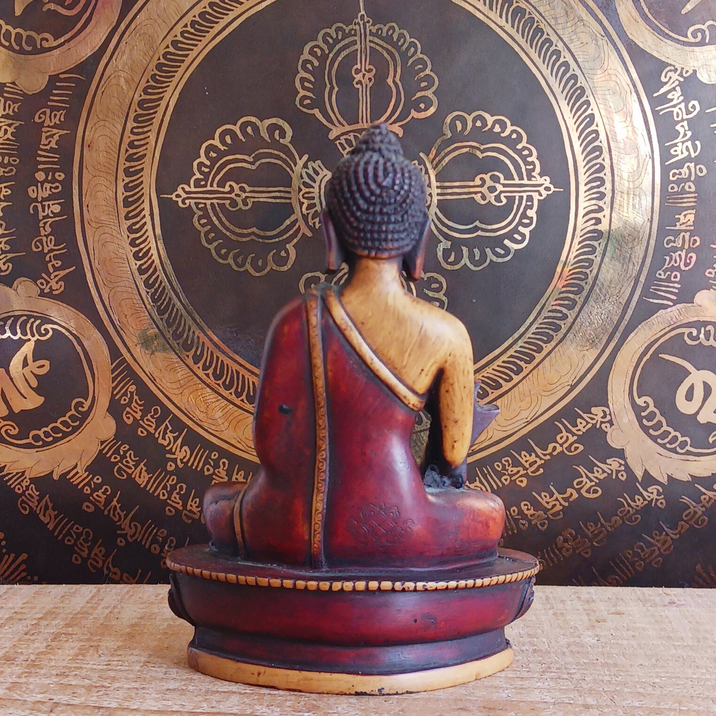 Invite healing, peace, and spiritual protection into your space with this beautifully crafted Medicine Buddha (Bhaisajya Tathagatta) statue in rich maroon and beige tones. Known as the Healing Buddha, Medicine Buddha embodies the power to cure the suffering of birth, sickness, and death. His luminous presence is traditionally described as shining like lapis lazuli, symbolizing purity and deep spiritual insight.
