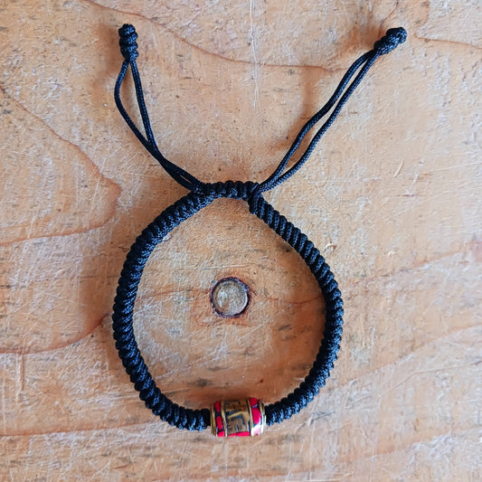 Experience the timeless beauty and spiritual symbolism of this handcrafted Tibetan Mantra Rope Bracelet. Each bracelet is skilfully woven with high-quality braided cord, designed to be durable, lightweight, and comfortable for daily wear.