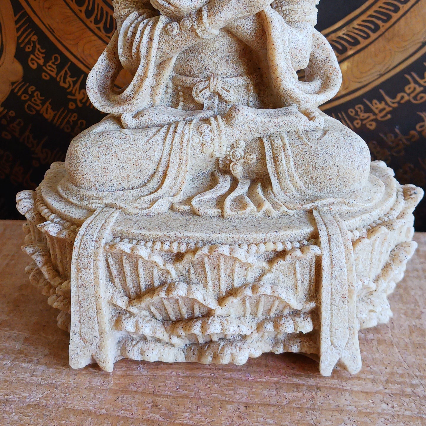 Elevate your sacred space with this beautifully crafted Sand Buddha Statue, inspired by traditional designs found in many Buddhist temples. Standing 17cm tall, this serene figure holds a Bell & Dorje, symbolizing wisdom and compassion in perfect harmony.