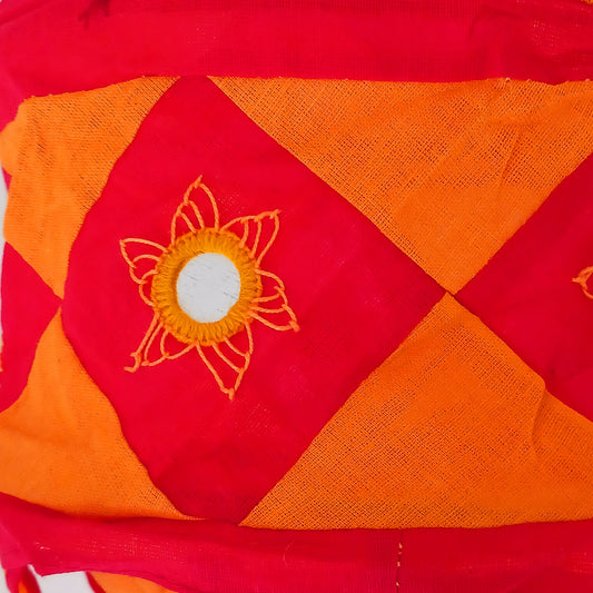 Bring colour, culture, and warmth into your space with this traditional handmade cotton Jhumar lampshade from Nepal. Carefully crafted by skilled artisans, each lampshade is made from vibrant cotton fabric and decorated with beautiful embroidered synthetic mirrors, creating a unique and eye-catching design.