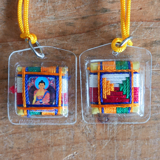 Invite peace, protection, and mindfulness into your life with this little Shakyamuni Buddha Tibetan Pendant. Skilfully crafted with traditional Tibetan design, this sacred pendant depicts Shakyamuni Buddha, the enlightened one, symbolizing serenity and spiritual guidance.