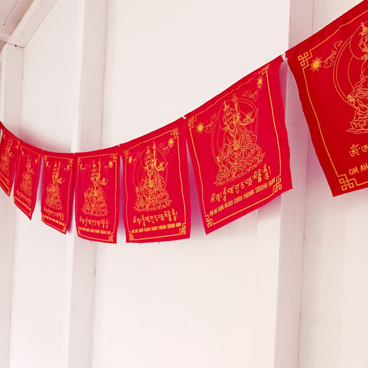 Invite the blessings of Guru Rinpoche, the “Precious Master,” into your home or sacred space with this beautiful set of prayer flags. Known as the founder of Tibetan Buddhism and an emanation of Buddha Amitabha, Guru Rinpoche brought the tantric teachings to Tibet in the 8th century, guiding countless beings on the path to enlightenment.