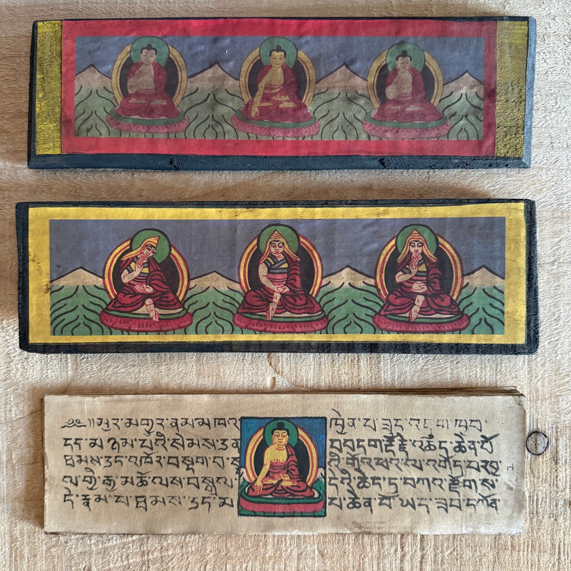 Handmade Tibetan Tantric Prayer Book with hand-painted Buddha and deities. Traditional Tibetan prayers on Daphne bark paper for health, prosperity, and meditation.