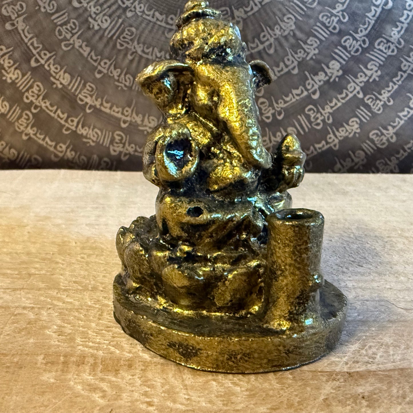 Small resin Ganesh incense holder in golden finish. Perfect for meditation, altar use, rituals, and bringing auspicious energy into your home.