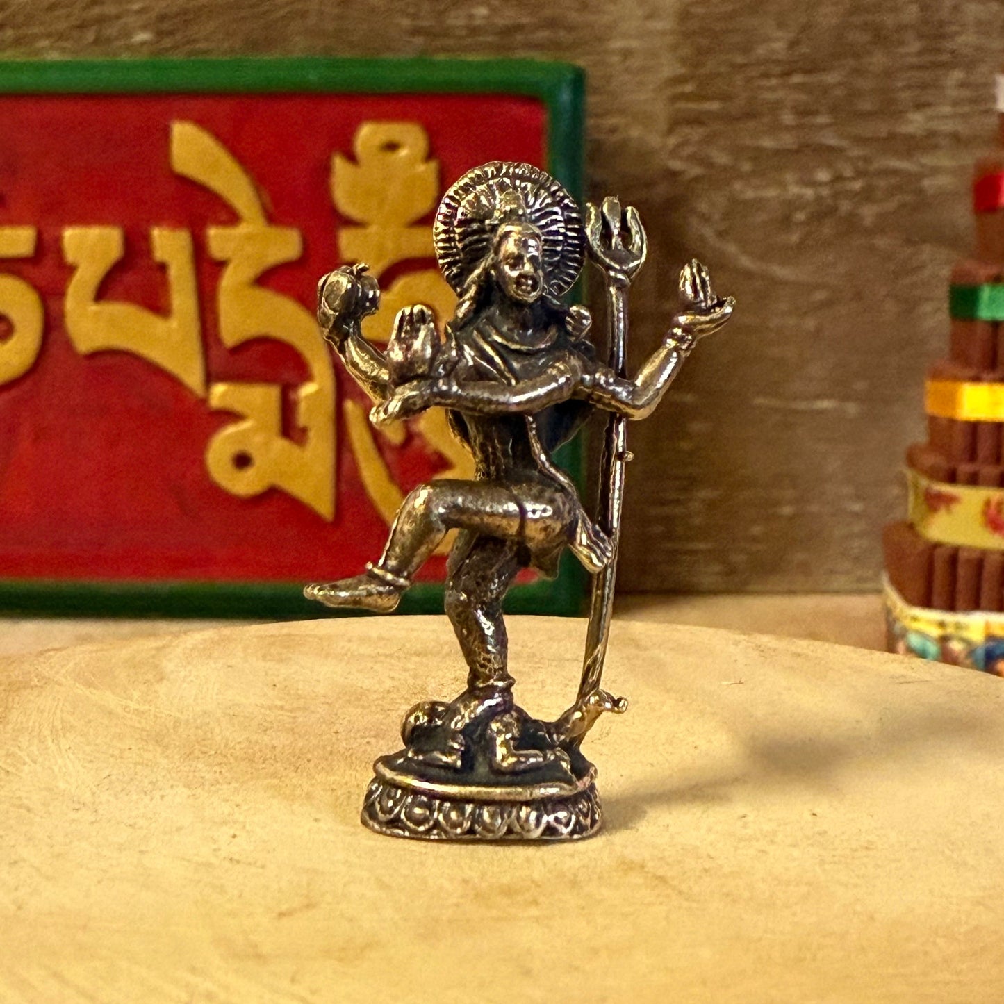 Celebrate the eternal rhythm of creation and renewal with the Mini Brass Dancing Shiva, a finely detailed brass sculpture depicting Lord Shiva in his sacred form as Nataraja, the Cosmic Dancer. Cast in radiant golden brass, this miniature statue captures Shiva’s graceful movement within the circle of flames—a symbol of the universe’s perpetual cycles of birth, preservation, and dissolution.