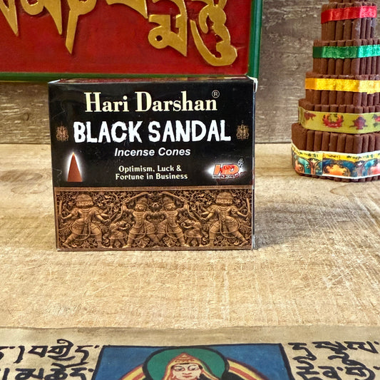 Create a calm and centered atmosphere with Hari Darshan Meditation Incense Cones, handcrafted in Bangalore, India, by traditional incense artisans devoted to purity and balance. Infused with the rich, woody essence of black sandalwood, these cones release a soothing fragrance that encourages mindfulness and inner peace.

Ideal for meditation, yoga, or quiet reflection, this grounding aroma helps still the mind and ease tension, guiding you toward a state of harmony and spiritual clarity. As the gentle smoke