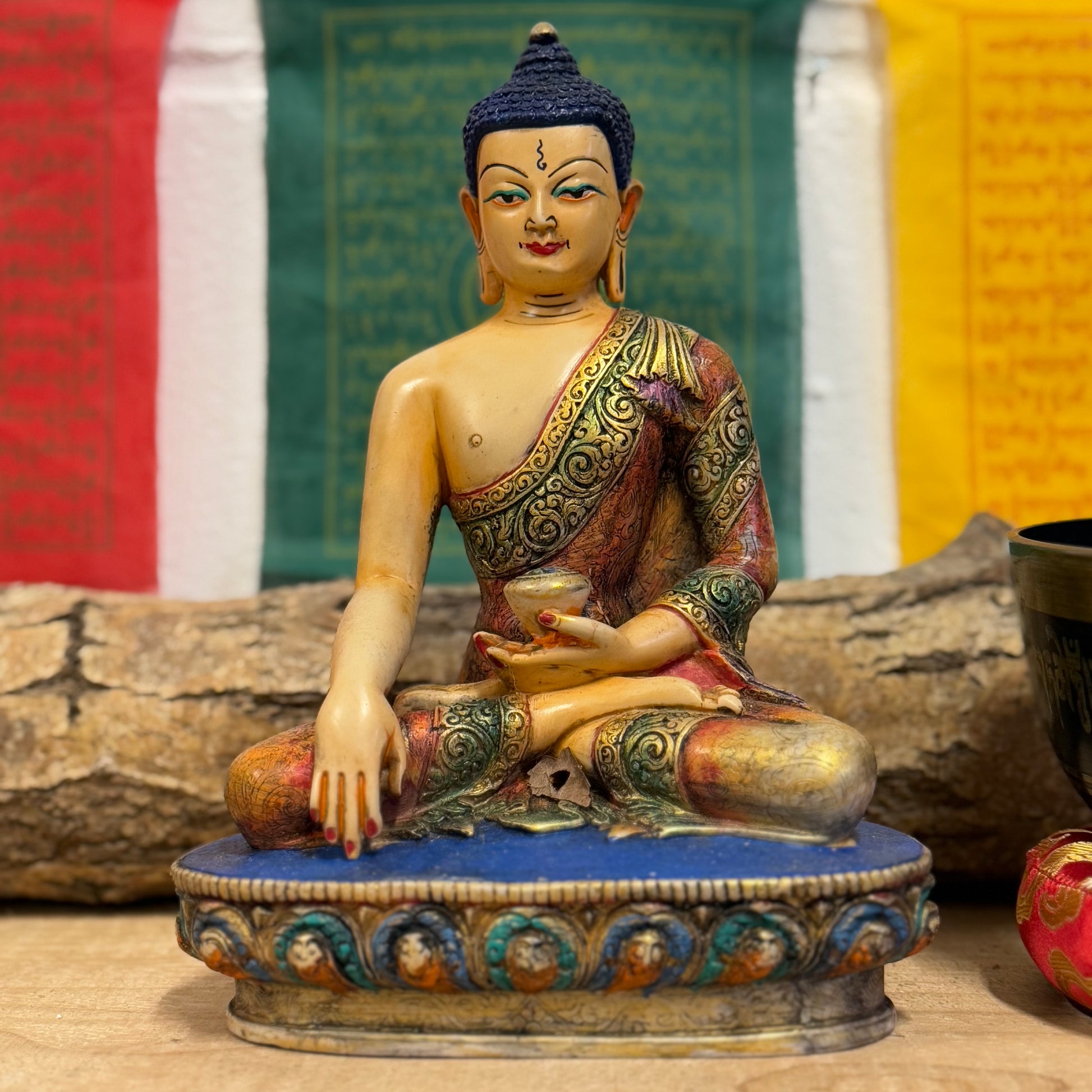 Hand-Painted Shakyamuni Buddha Statue – Traditional Thangka Style – 20cm

This stunning Shakyamuni Buddha statue, crafted from clay and resin, is a beautiful representation of supreme awareness and compassionate understanding. Painted using the traditional Thangka colors, this statue adheres to the exact color descriptions prescribed in Buddhist tradition, ensuring an authentic and vibrant depiction of the Buddha. Each piece is hand-painted by skilled artisans in Nepal, reflecting the meticulous craftsmansh