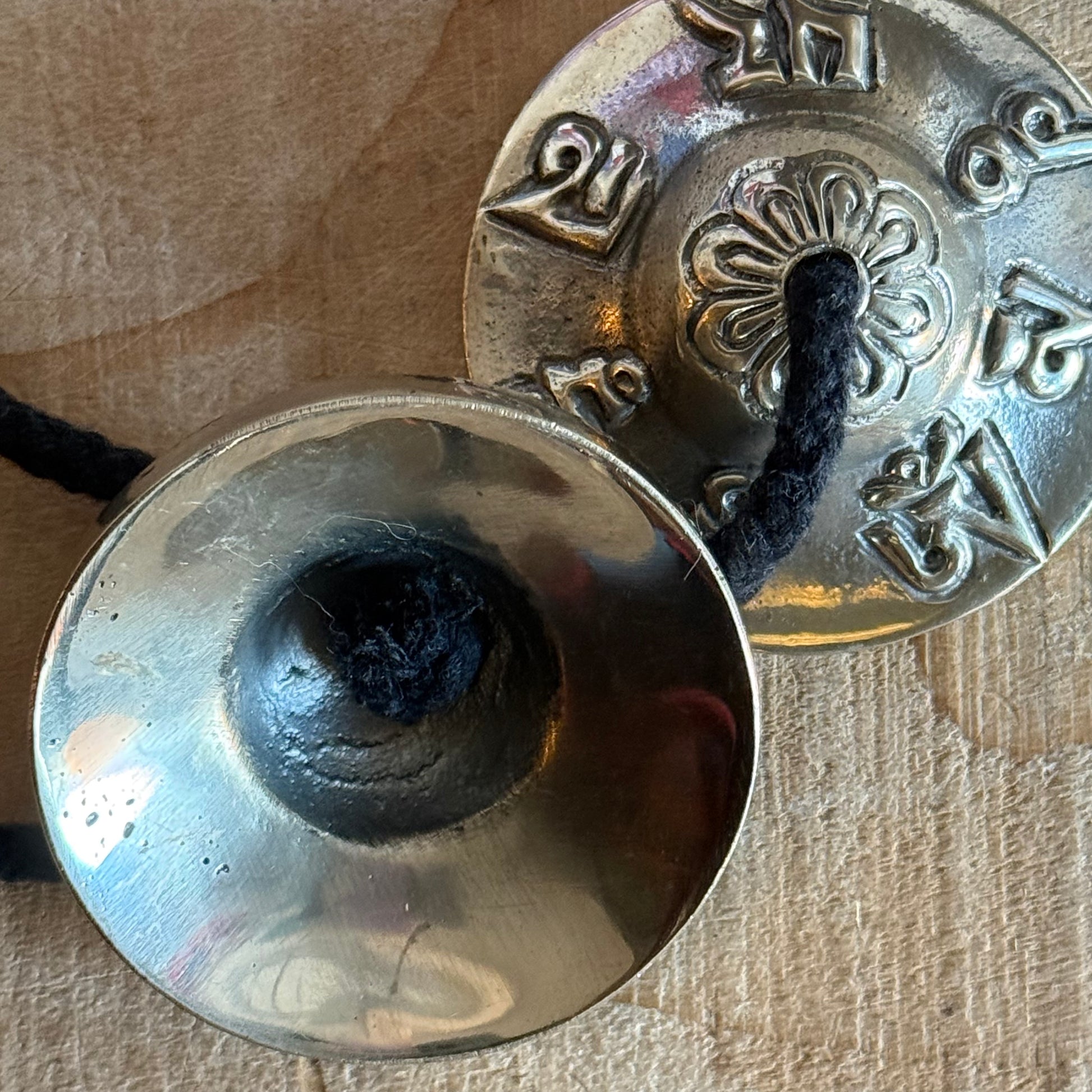 Vegan Tibetan tingsha cymbals with cotton strap. Ideal for meditation, prayer, sound healing, and space clearing. Handmade in Nepal.