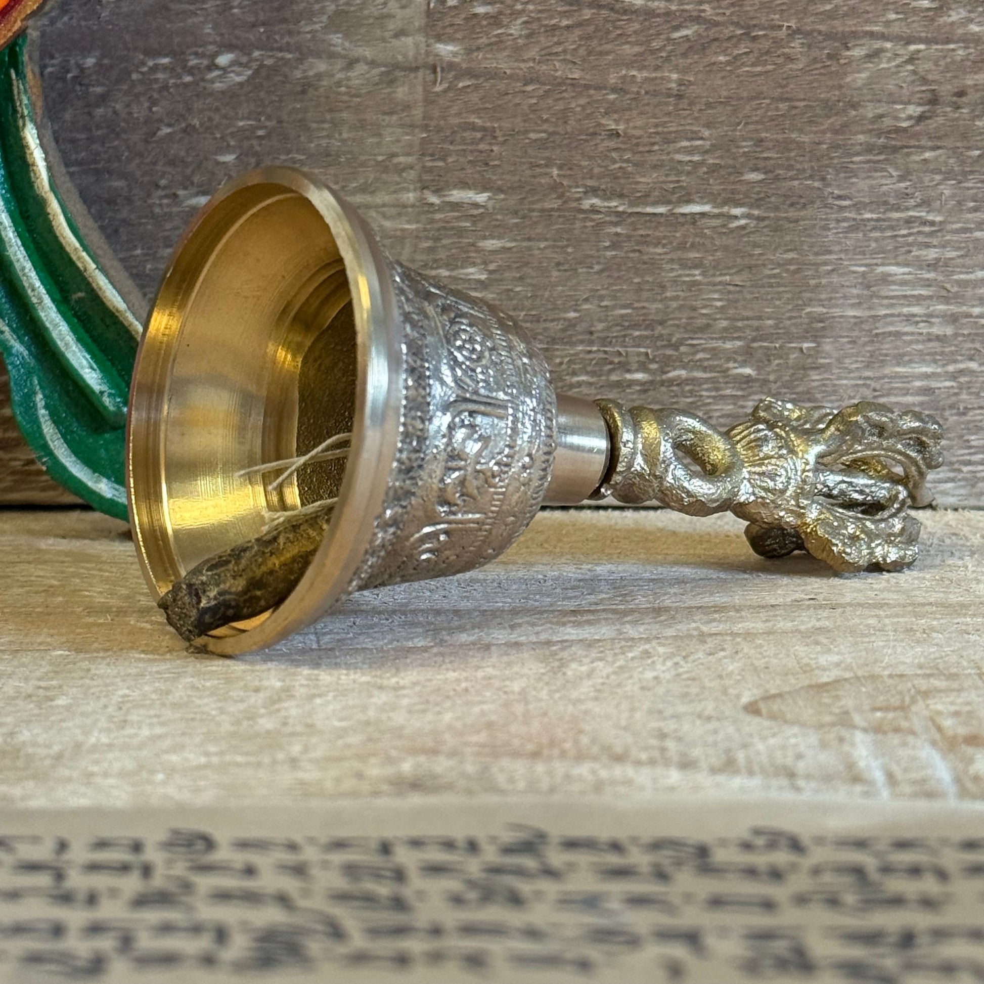 The Medium Tibetan Tingsha Bell is a sacred sound instrument, handcrafted with devotion and precision by skilled Tibetan artisans. Measuring 6 x 11.5 cm, it carries the essence of ancient mindfulness and Tibetan spiritual traditions.