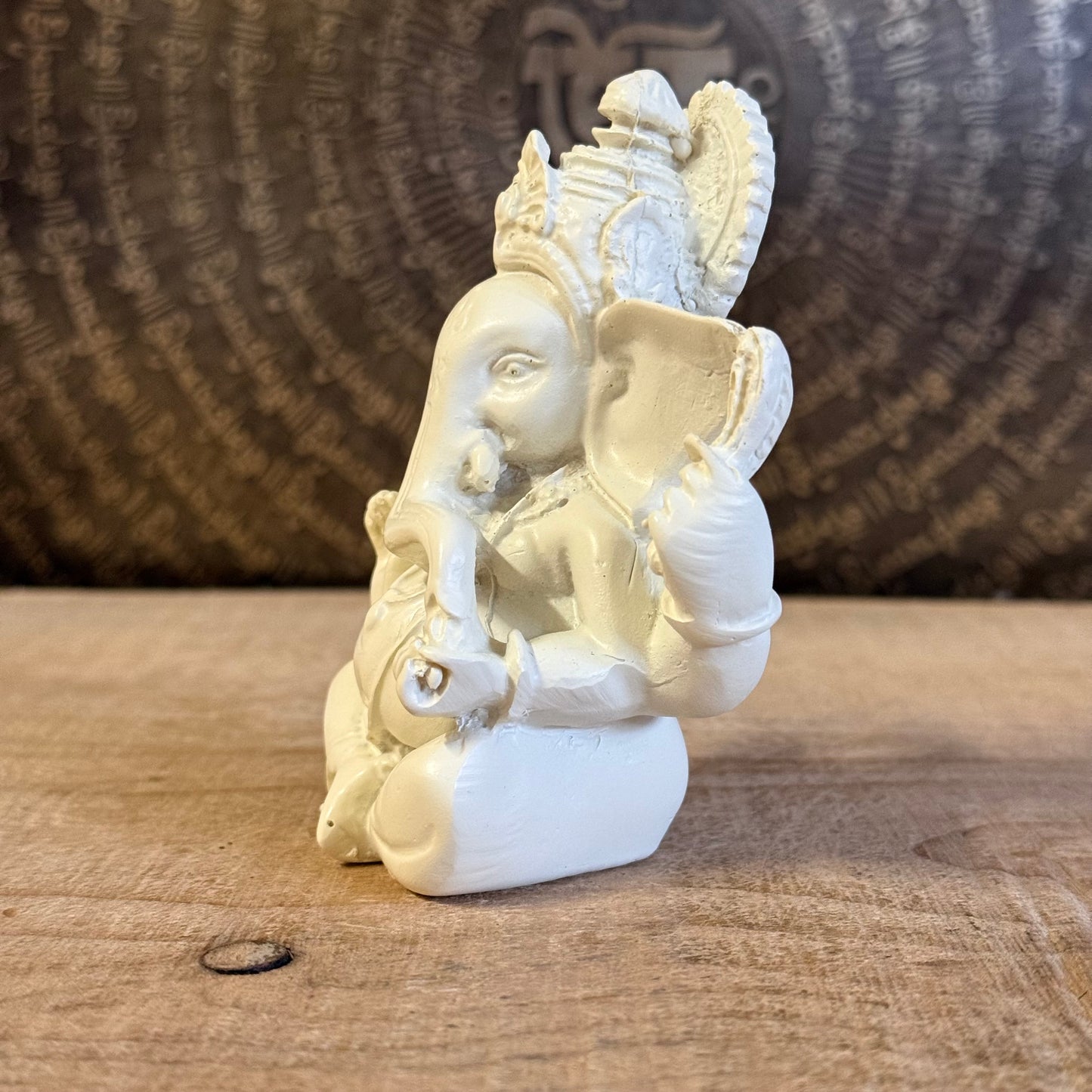 Bring luck and wisdom home with this 11cm Ganesh Statue. The four-armed elephant god symbolizes prosperity, protection, and spiritual success.
