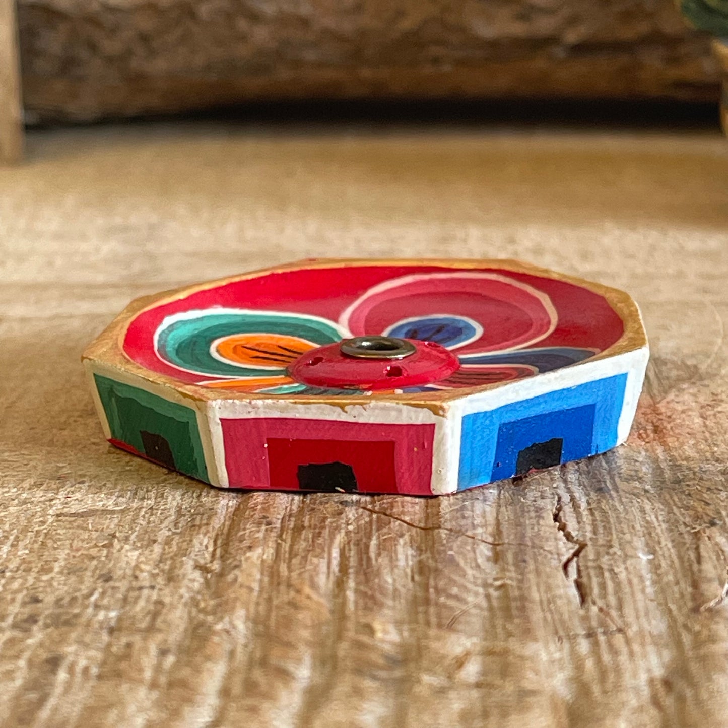 A beautiful Hand painted Tibetan Incense stick holder , Hand painted and ethically sourced this incense Holder is Perfect for the Larger Tibetan Incense it also has 4 small holes for Indian sticks.