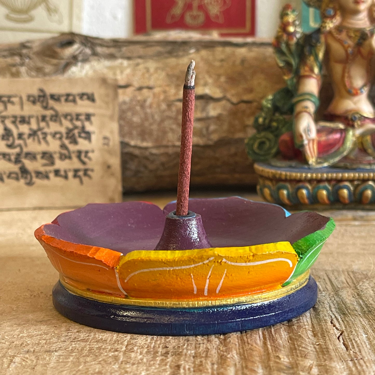 A beautiful hand painted Tibetan Incense stick holder. This handmade Lotus Incense holder is made from wood and painted in the seven chakra design in Nepal by skilled artisans. A beautifully hand-painted burner that is perfect for the larger Tibetan incense.