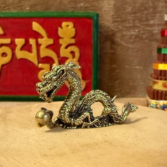 Embodying the ancient spirit of strength and transformation, the Mini Brass Dragon is a finely detailed sculpture handcrafted in Bali from solid brass. Each piece is cast using traditional metalworking techniques, where molten brass is poured into a mould and finished by hand, revealing the dragon’s intricate scales and expressive form.