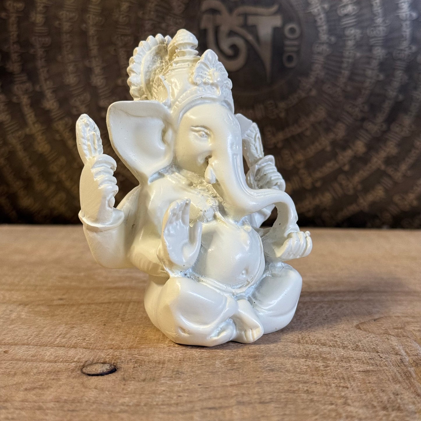 Bring luck and wisdom home with this 11cm Ganesh Statue. The four-armed elephant god symbolizes prosperity, protection, and spiritual success.