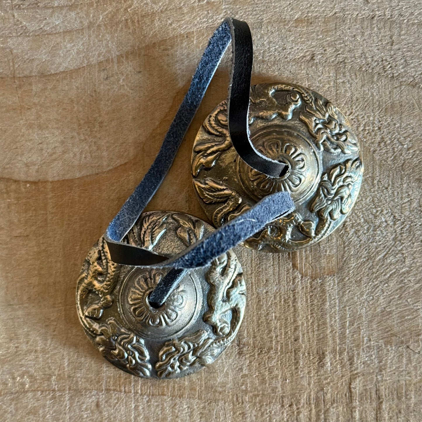 Boxed Naga Tingsha cymbals for meditation and prayer. Handcrafted in Nepal, embossed with sacred Naga or Dragon, perfect for altars and rituals.