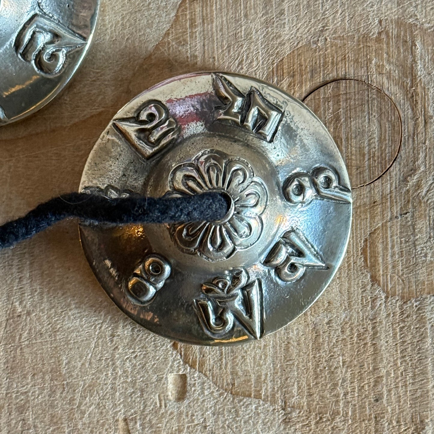 Vegan Tibetan tingsha cymbals with cotton strap. Ideal for meditation, prayer, sound healing, and space clearing. Handmade in Nepal.