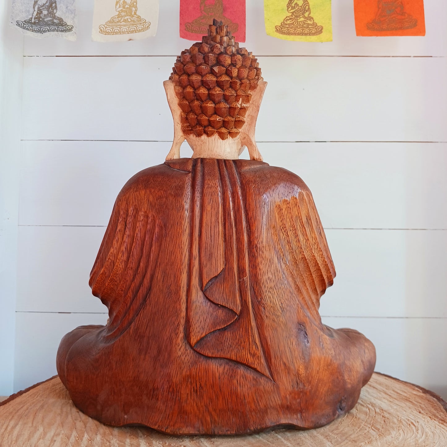 his beautifully serene Teaching Buddha statue has been carved by hand from Suar wood which is a fast-growing species, allowing for sustainable cultivation. The Albizia Saman species of tree is widespread, abundant, and in no danger of extinction. The Buddha is carved using tools in the traditional Balinese way, bringing each detail to life in a three-dimensional work of art. Hand carved Buddha statues can take up to weeks to carve.  The Buddha is in the Teaching Pose which signifies wisdom, understanding an