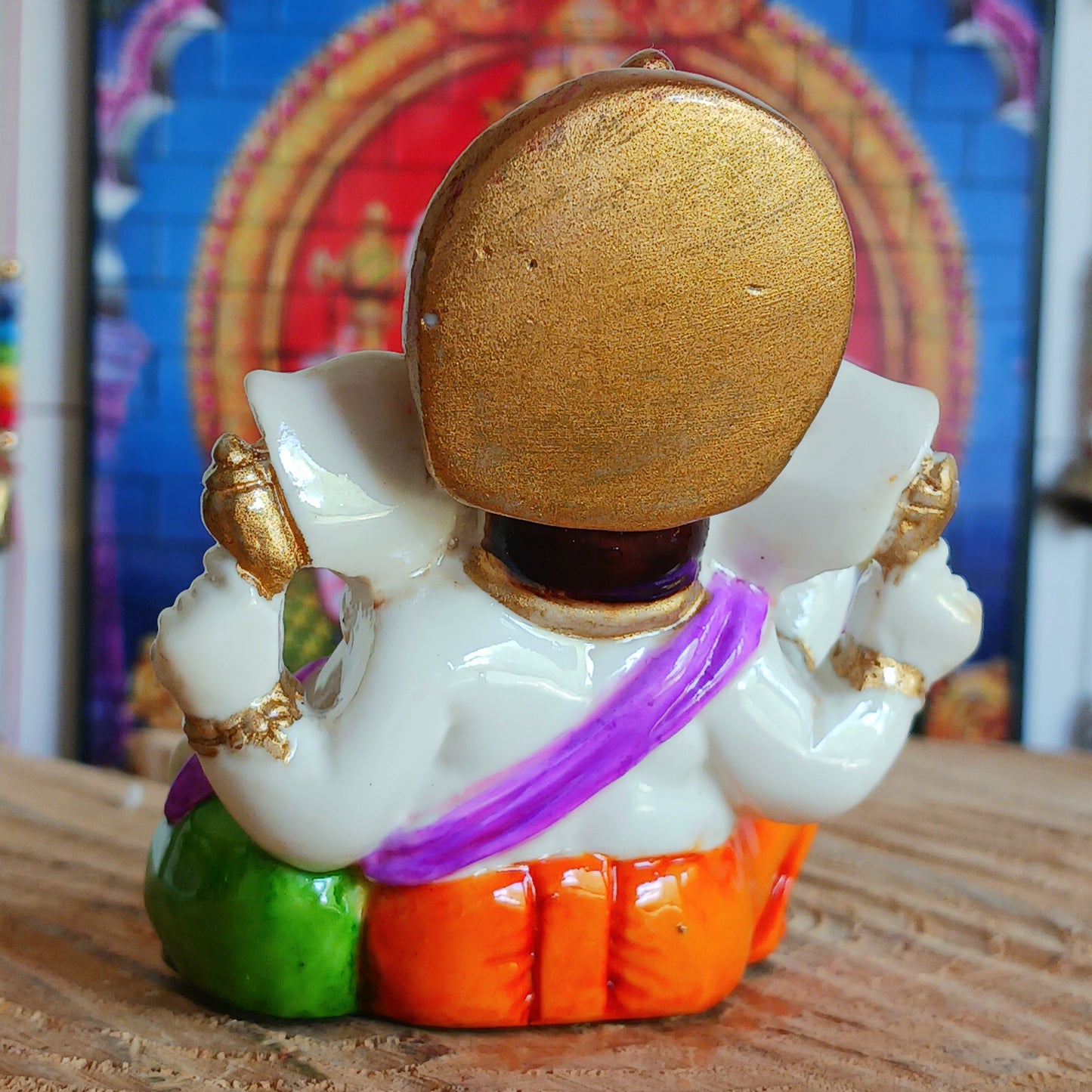 This delightful Ganesha statue is made of resin.&nbsp; In his upper left arm, this Ganesha holds a stick (ankusha), which is used to remove obstacles and guide the devotee's direction. In his upper right arm, he holds a noose (pasha), which symbolizes the power to control desire.