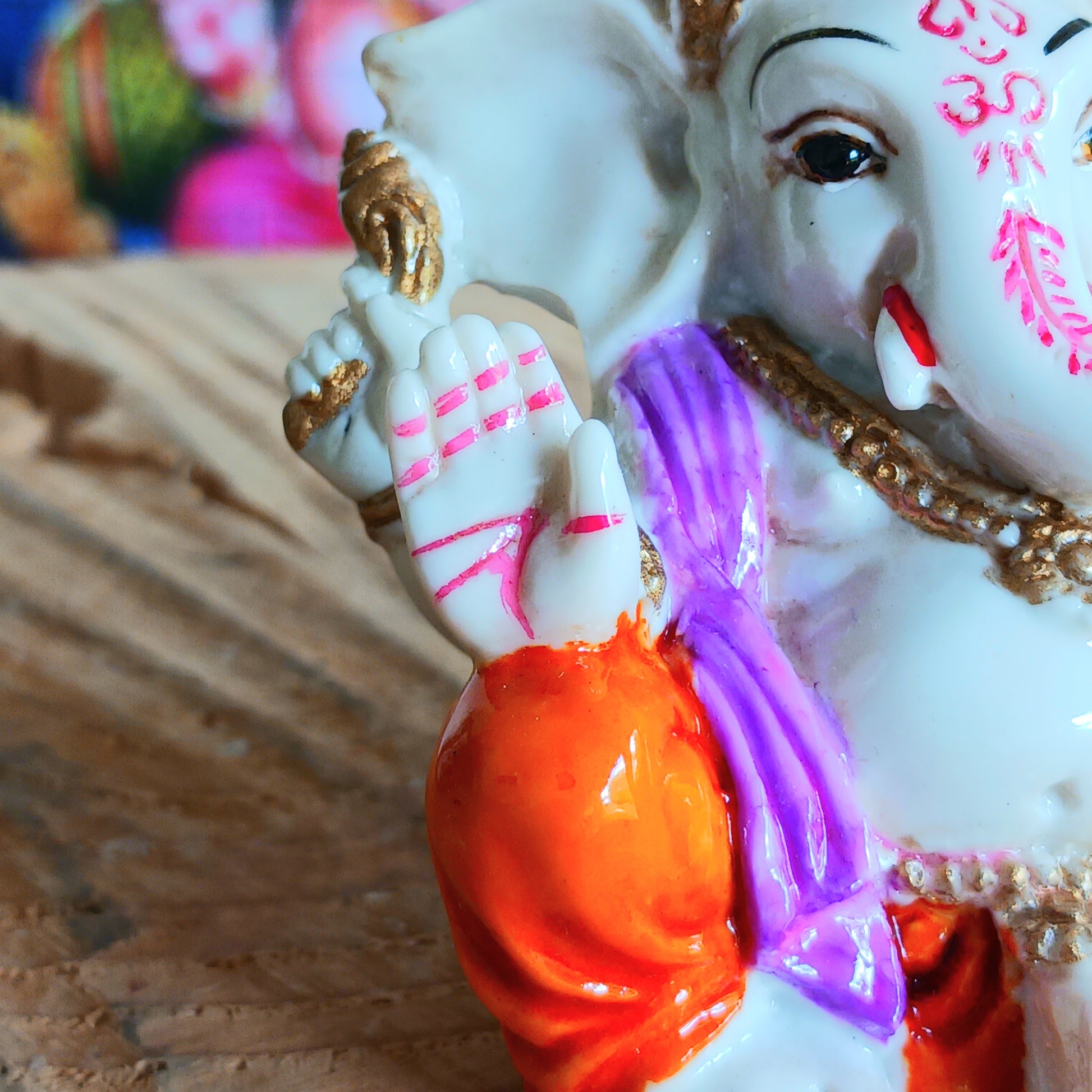 This delightful Ganesha statue is made of resin.&nbsp; In his upper left arm, this Ganesha holds a stick (ankusha), which is used to remove obstacles and guide the devotee's direction. In his upper right arm, he holds a noose (pasha), which symbolizes the power to control desire.