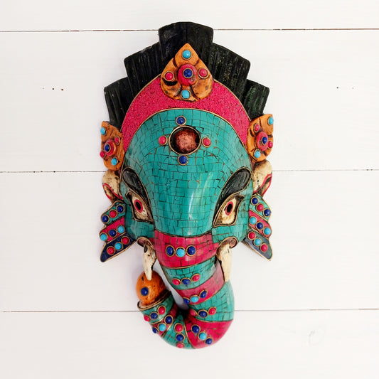 This stunning, handcrafted Lord Ganesh wooden mask is inlaid with Turquoise, Corals and Lapis.