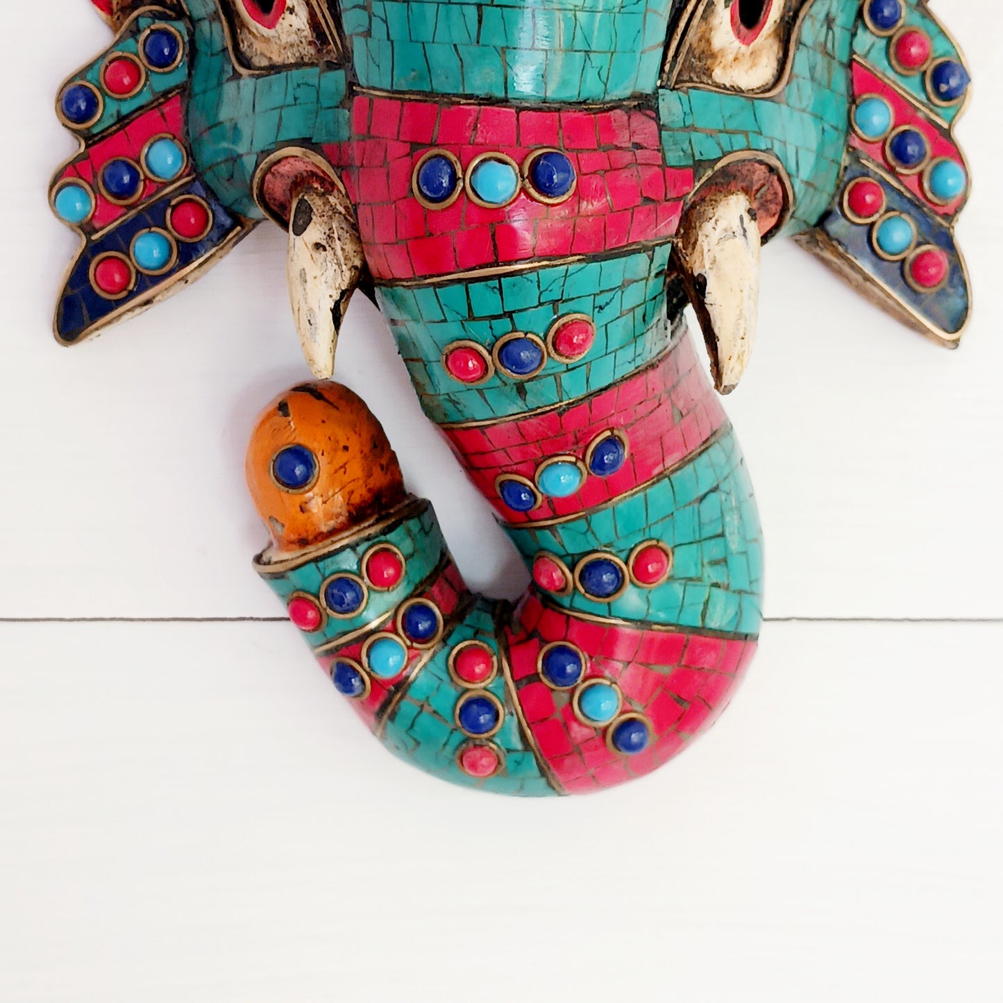 This stunning, handcrafted Lord Ganesh wooden mask is inlaid with Turquoise, Corals and Lapis.