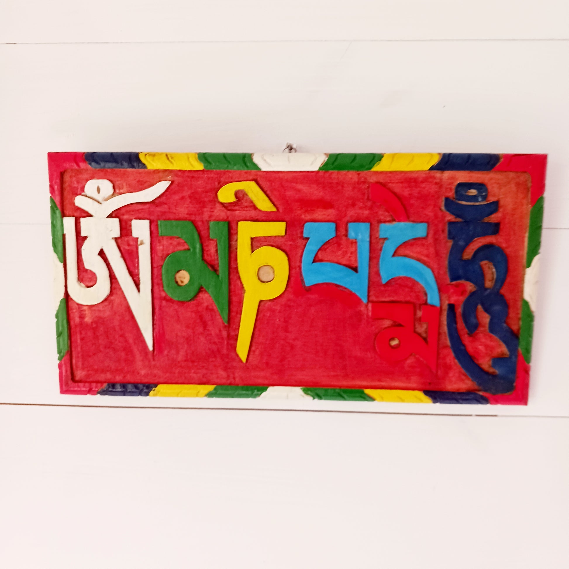 Decorative wooden hand painted Om mani padme hum Buddhist mantra wooden wall hanging.