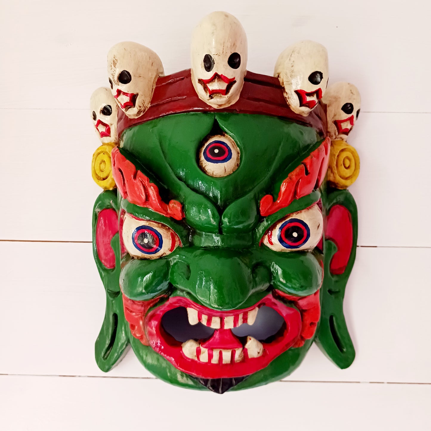 his Mahakala mask is a beautifully handcrafted wooden piece featuring intricate details and a unique design. Inspired by the powerful deity, this mask is a representation of strength, protection, and courage.