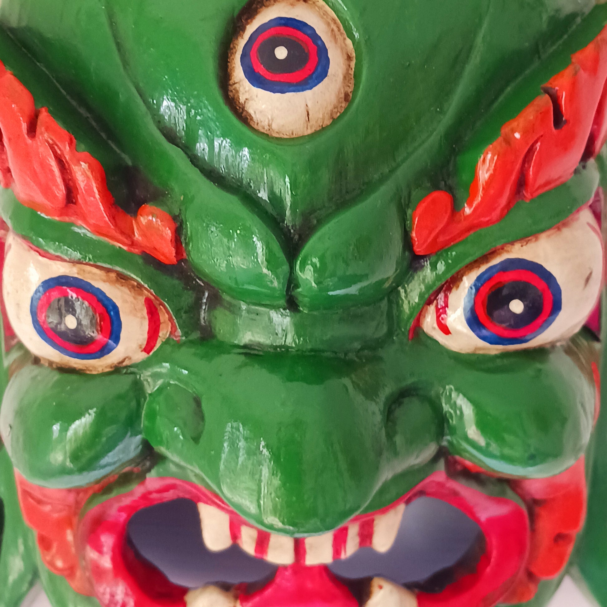 his Mahakala mask is a beautifully handcrafted wooden piece featuring intricate details and a unique design. Inspired by the powerful deity, this mask is a representation of strength, protection, and courage.