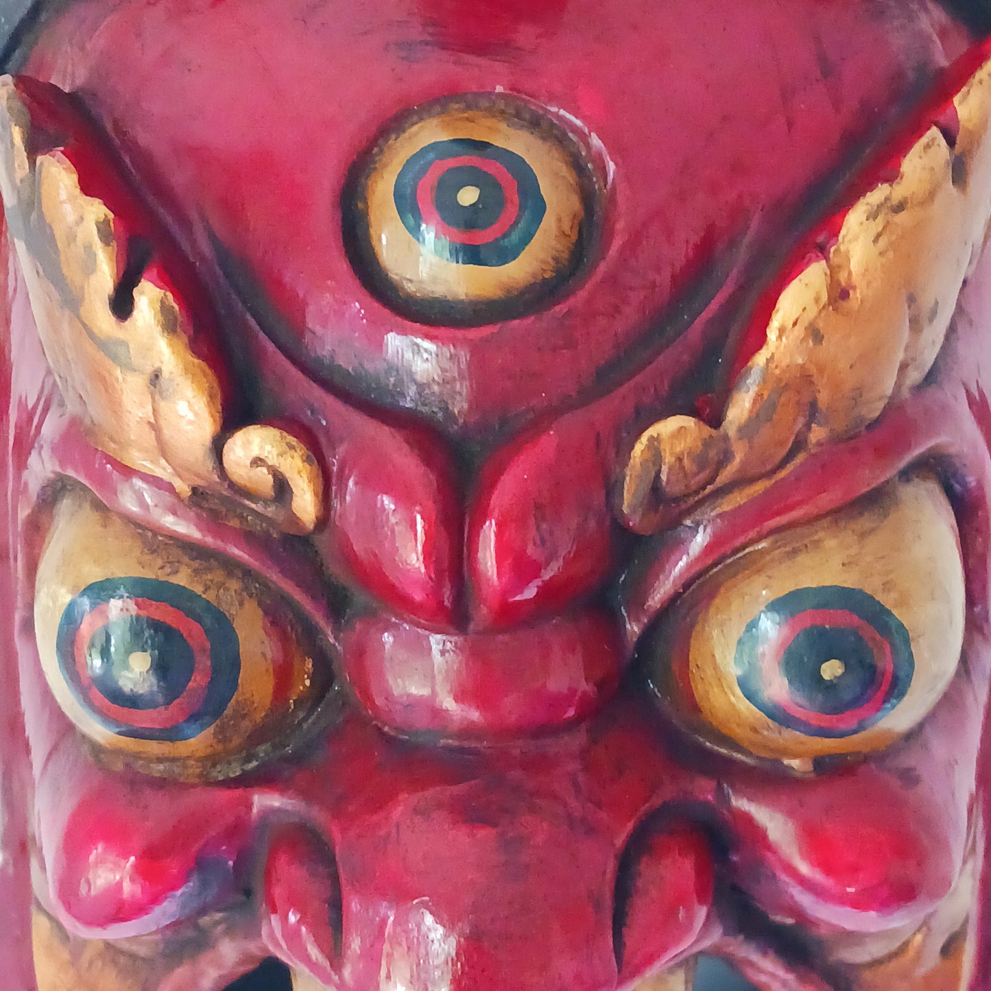 This Mahakala mask is a beautifully handcrafted wooden piece featuring intricate details and a unique design. Inspired by the powerful deity, this mask is a representation of strength, protection, and courage. Display it as a statement piece or use it in rituals for positive energy. 